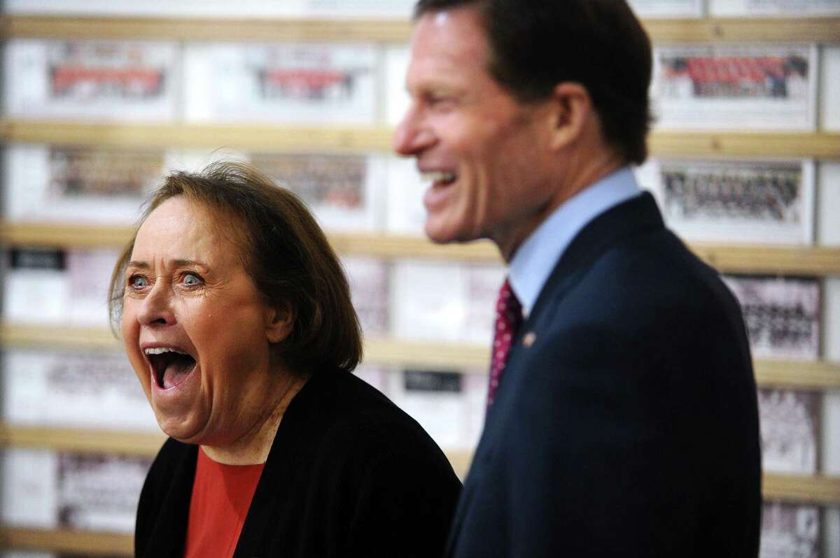 Figure Skating Hall of Famer Slavka Button smiles as she is surprised with a certificate of recognition from U.S. Sen. Richard Blumenthal, D- Conn., inside Dorothy Hamill Rink on Sue Merz Way in Greenwich on Monday. Button once coached Olympians Maia and Alex Shibutani,who are currently competing in Pyeongchang.