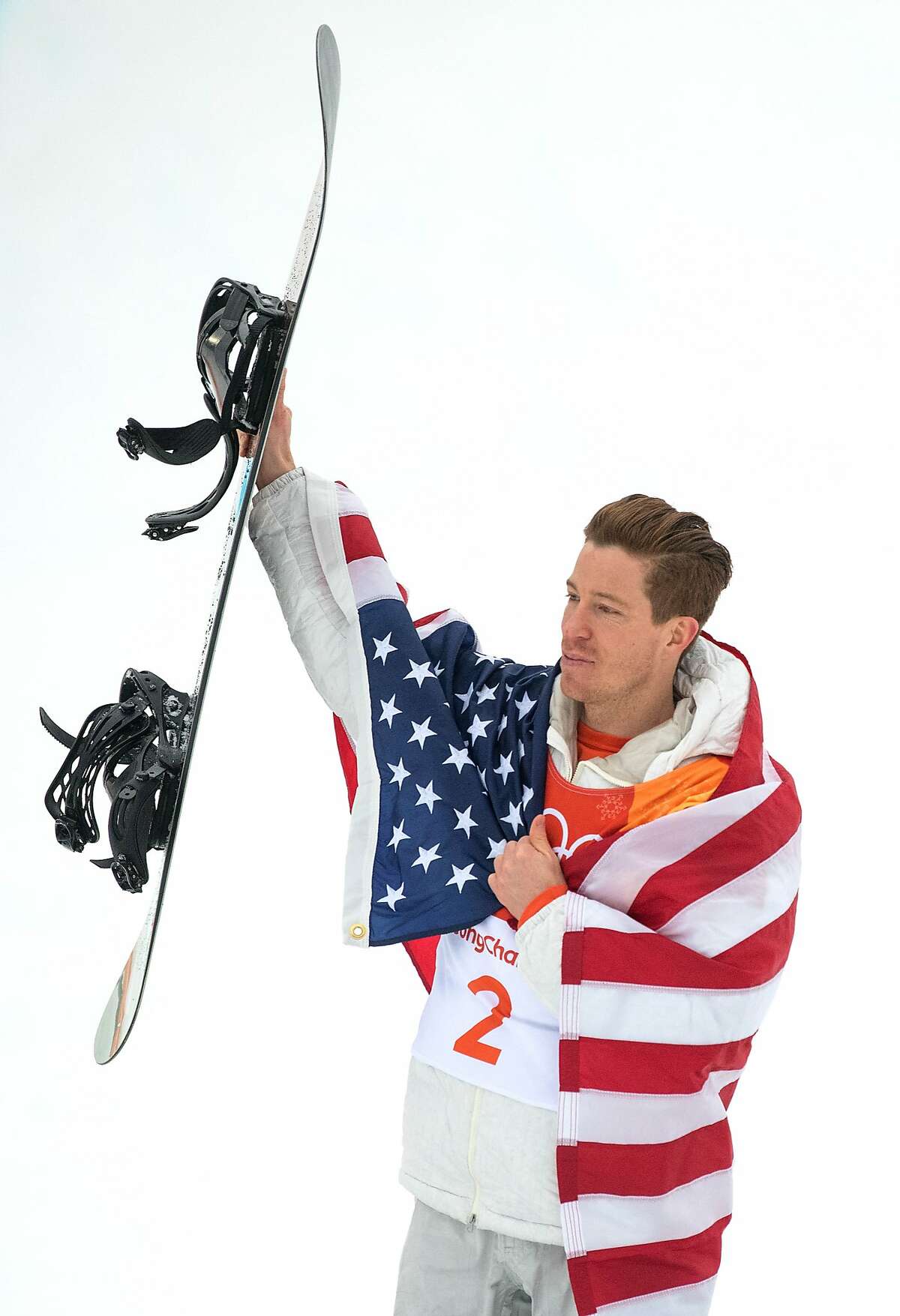 PYEONGCHANG-GUN, SOUTH KOREA - FEBRUARY 14: Gold medalist Shaun White of the United States celebrates during the victory ceremony for the Snowboard Men's Halfpipe Final on day five of the Pyeongchang 2018 Winter Olympics at Phoenix Snow Park on February 14, 2018 in Pyeongchang-gun, South Korea. (Photo by David Ramos/Getty Images)