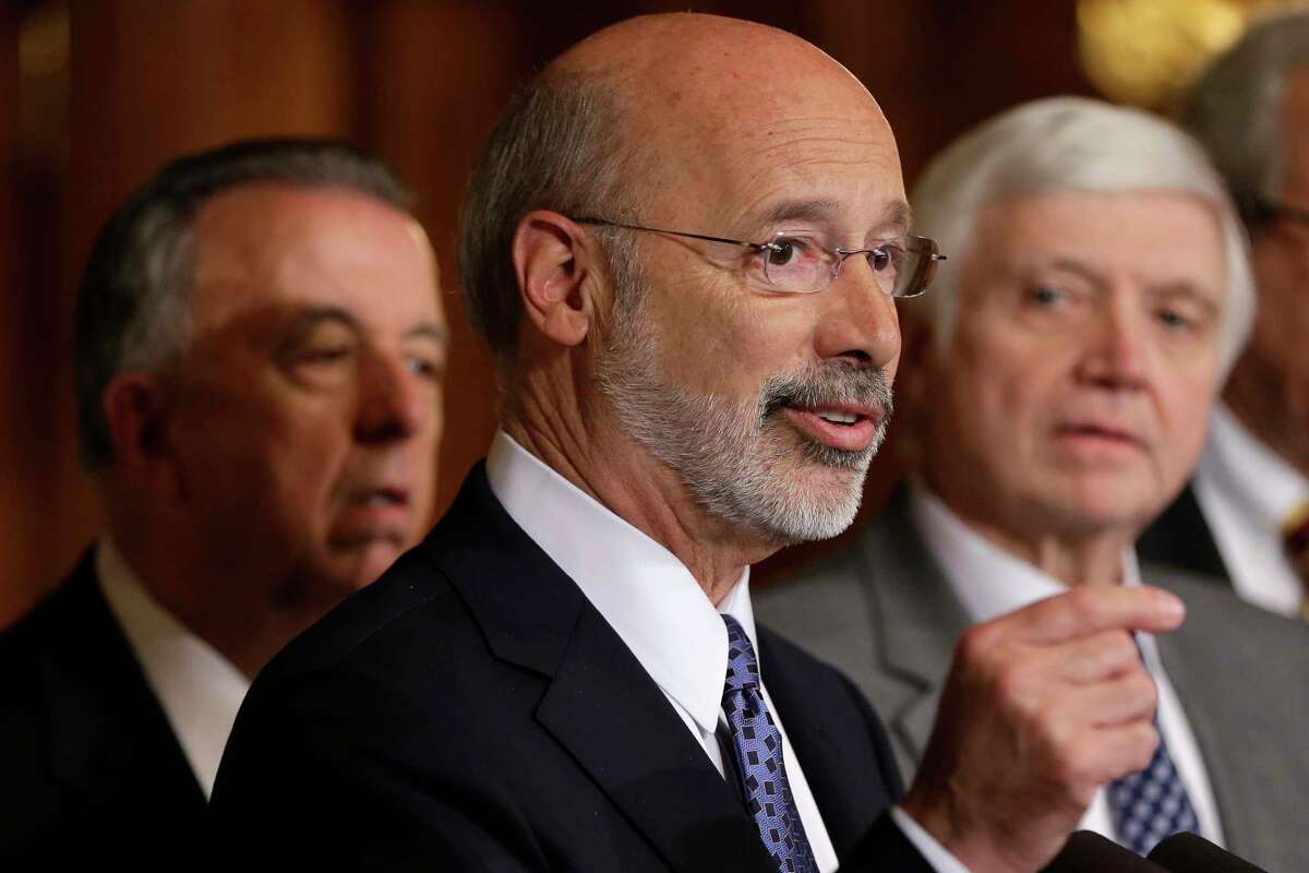 FILE - In this Oct. 7, 2015, file photo, Pennsylvania Gov. Tom Wolf, center, accompanied by state House Minority Leader Rep. Frank Dermody, right, D-Allegheny, and state Rep. Joe Markosek, left, D-Allegheny, discuss state budget negotiations at the state Capitol in Harrisburg, Pa. Pennsylvania's high court issued a new congressional district map for the state's 2018 elections on its self-imposed deadline Monday, Feb. 19, 2018, all but ensuring that Democratic prospects will improve in several seats and that Republican lawmakers challenge it in federal court. The map of Pennsylvania's 18 congressional districts is to be in effect for the May 15 primary and substantially overhauls a congressional map widely viewed as among the nation's most gerrymandered. The map was approved in a 4-3 decision. (AP Photo/Matt Rourke, File)