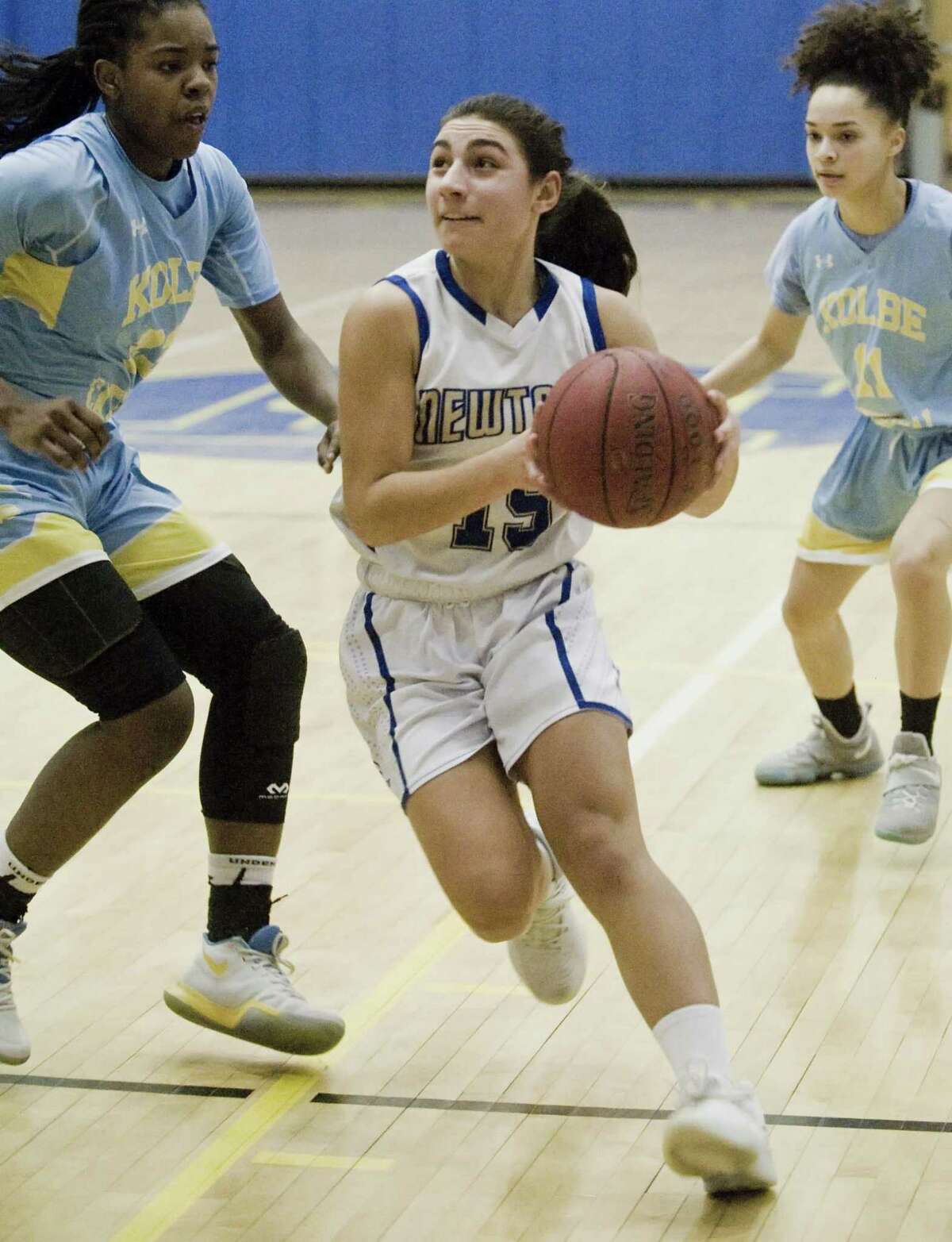 Newtown High School's Jacquelyn Matthews heads to the basket in the SWC Girls basketball semifinal against Kolbe Cathedral High School, played at Newtown. Monday, Feb. 19, 2018