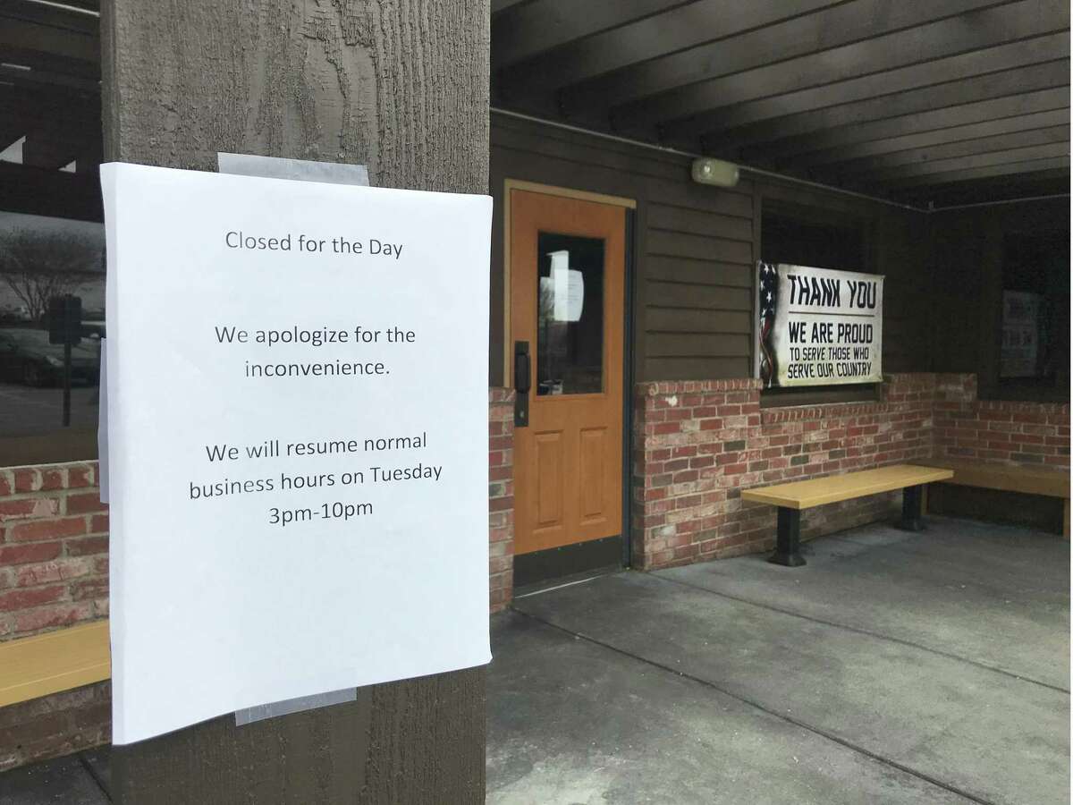 A sign at the Texas Roadhouse indicates the restaurant was closed on Monday. A shooting outside the restaurant left five people wounded Sunday night.