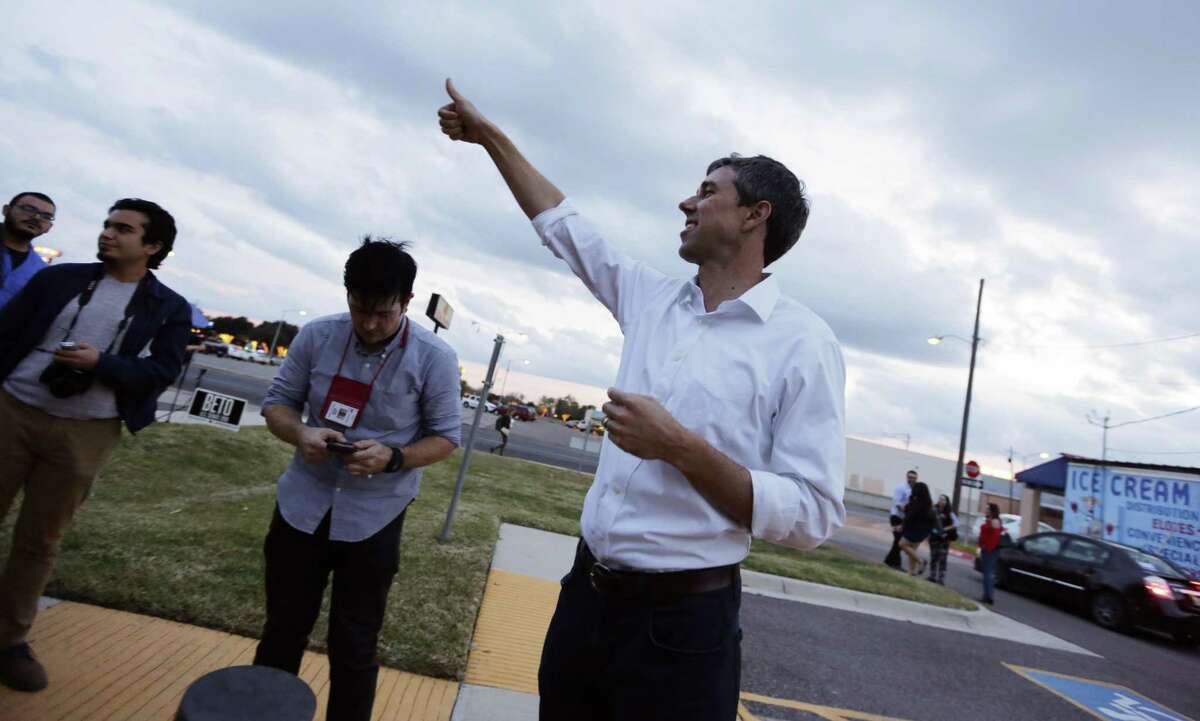 In this Saturday, Jan. 6, 2018, photo, Texas Democratic Congressman Beto O'Rourke, right, gives a "thumbs-up" to a supporter following a town hall meeting in Mission, Texas. O?’Rourke is forsaking a safe seat in Congress and a rising-star career for the longest of odds in an attempt to unseat Texas Republican Sen. Ted Cruz. High-energy, bilingual and photogenic, with a lanky, 6-foot-4 frame and a mop of dark hair that?’s begun turning gray, O?’Rourke reminds some in Texas of a Spanish-speaking Kennedy. (AP Photo/Eric Gay)
