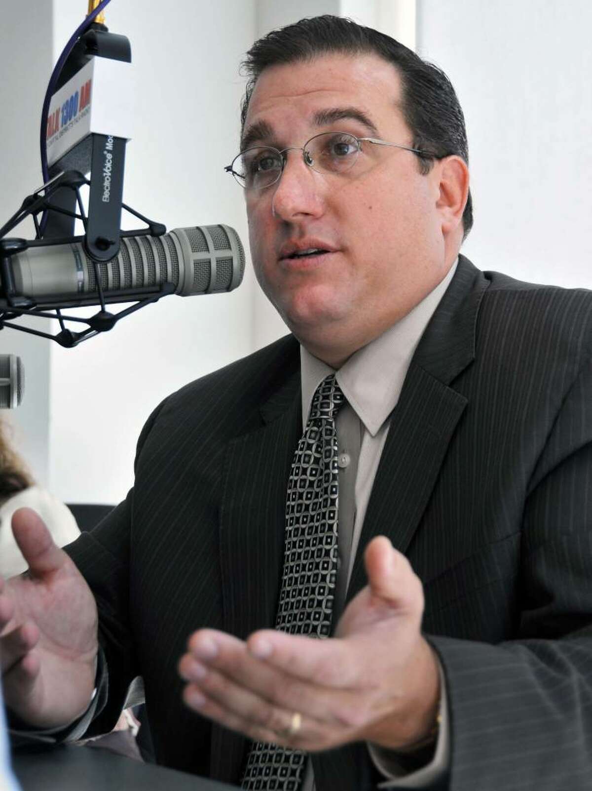 Albany police union President Christian Mesley in the studio of 1300 AM in September 2009. Mesley has filed a lawsuit claiming he suffered "public hatred" and stress from comments made by District Attorney David Soares. (John Carl D'Annibale / Times Union)