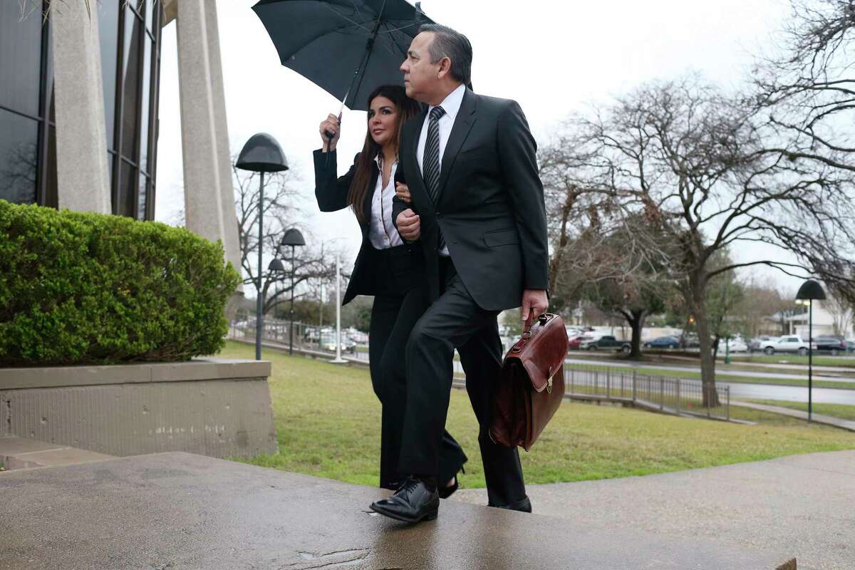 Texas State Sen. Carlos Uresti and his wife, Lleanna, arrive at the John H. Wood, Jr., United States Courthouse for closing arguments in his criminal fraud trial, Tuesday, Feb. 20, 2018. The charges stem from his involvement in the FourWinds Logistics company, a fracking sand venture. The company's consultant, Gary Cain, is a co-defendant in the case.