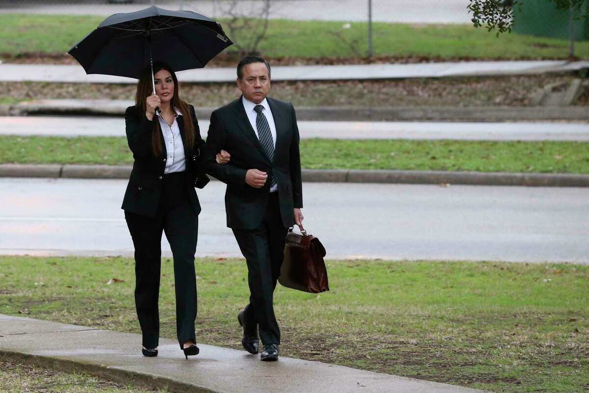 Texas State Sen. Carlos Uresti and his wife, Lleanna, arrive at the John H. Wood, Jr., United States Courthouse for closing arguments in his criminal fraud trial, Tuesday, Feb. 20, 2018. The charges stem from his involvement in the FourWinds Logistics company, a fracking sand venture. The company's consultant, Gary Cain, is a co-defendant in the case.