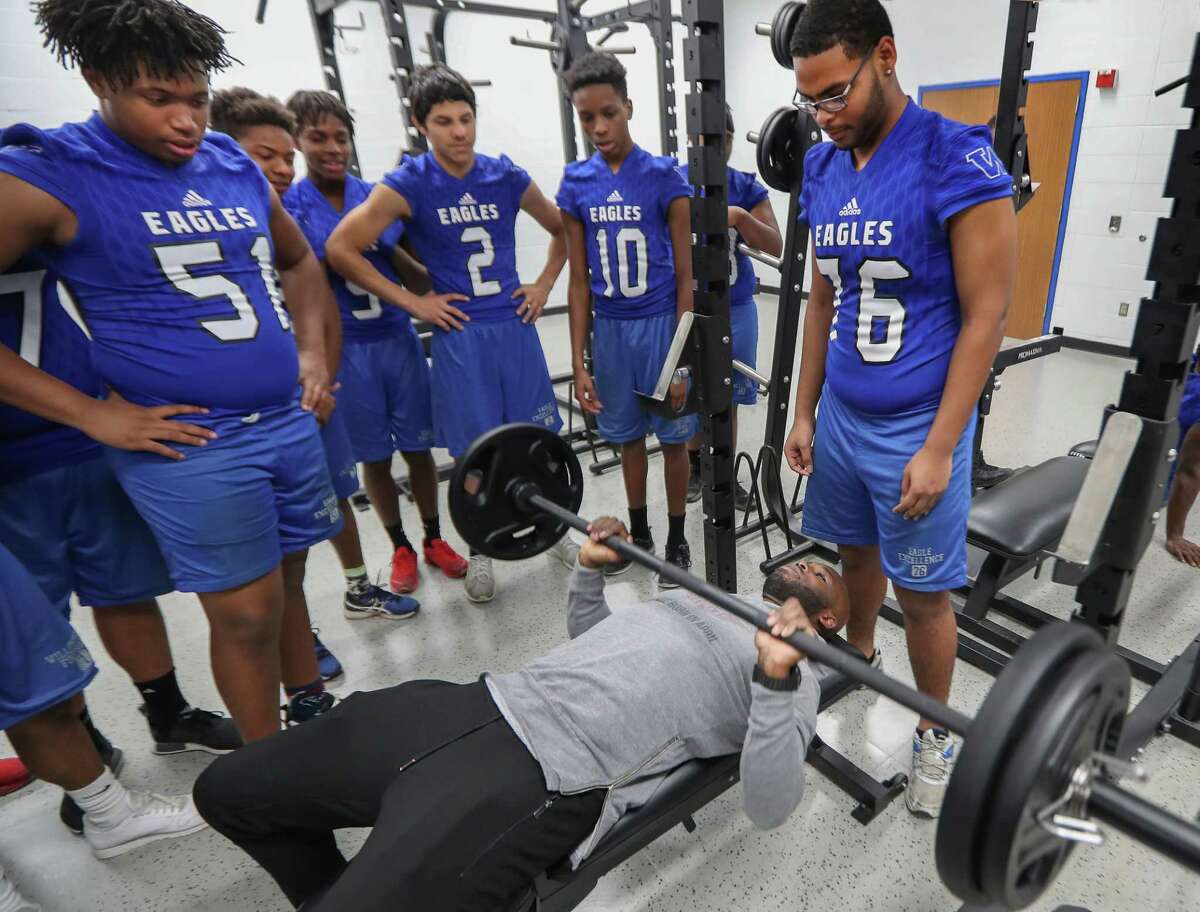 Houston Texans cornerback Johnathan Joseph lifts some weights under the watchful eyes of the Willowridge High School Football Team Tuesday, Feb. 13, 2018, in Houston. Joseph and UnitedHealthcare donated a new weight room equipment to Fort Bend ISD's Willowridge High School athletics. The new equipment replaces items damaged by mold discovered at WHS this summer. After extensive remediation and cleanup, students returned to WHS in January. The donation was made possible by a $10,000 grant from UnitedHealthcare to Joseph's Dreambuilders program. ( Steve Gonzales / Houston Chronicle )