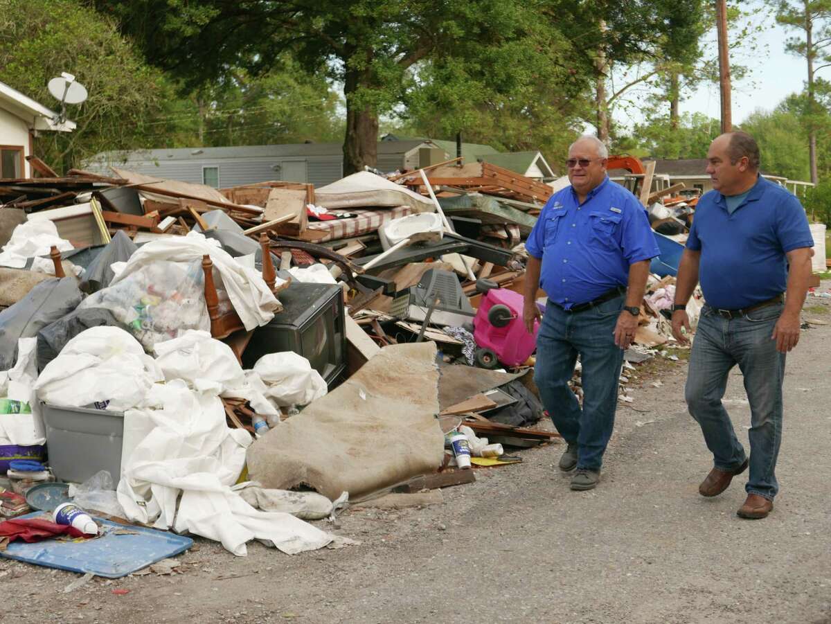 Left, Mickey Caison, Response Director at SEND Relief, and Richard Trethewey of "Ask This Old House" walk past piles of debris in Houston after Hurricane Harvey. “We were blown away by the level of volunteerism that we saw. One of those grouops had been there months and months, living in tents and sleeping on cots and they did it with a smile, every day,” Trethewey said. “There were all kinds of groups. It reminds you that people are really, really good.”
