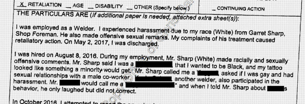 An excerpt of the complaint filed by Zachery Brinker with the Texas Workforce Commission, according to Harris County court records. The Chronicle has redacted the alleged slurs and the name of one employee.