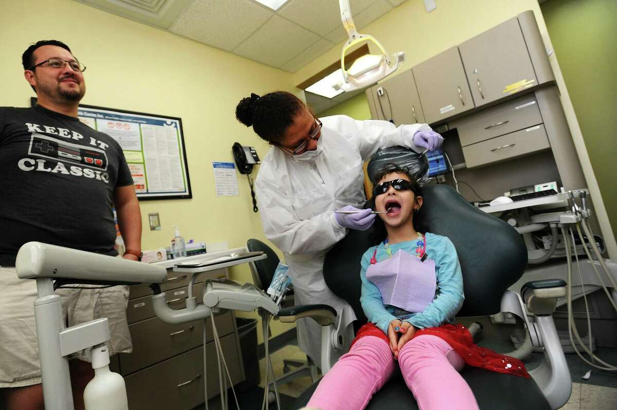 Six-year-old Sophia Martinez, of Stamford, gets her teeth examined as part of the Community Health Center's (CHC) free oral health services for children without dental insurance inside the Community Health Center on Franklin St. in downtown Stamford, Conn. on Tuesday, Feb. 20, 2018. CHC partnered with the Give Kids a Smile program and, for the entire month of February, gives children cleanings, exams, restorative care, fluoride treatments, sealants, fillings and dental education.