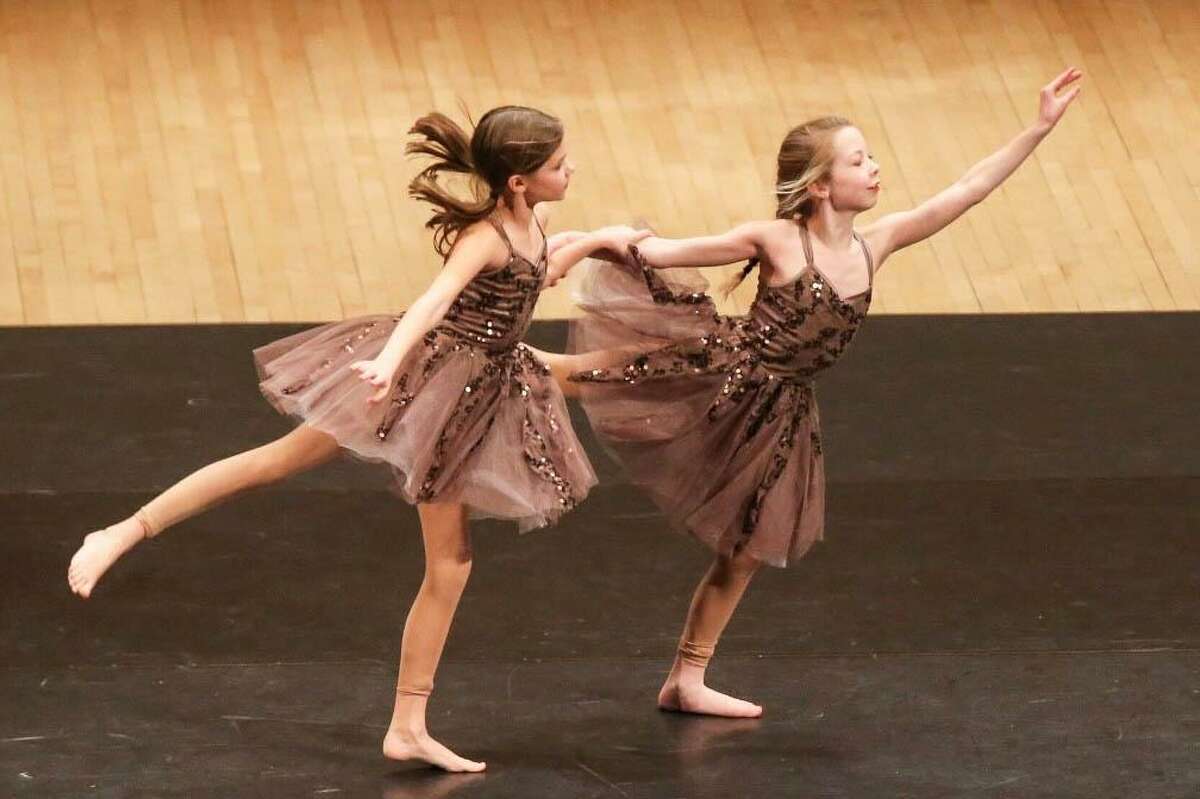 Katelyn Brunner and Avery Rubini, who are members of D-Tour, New Milford’s Studio D’s dance company, perform on stage at Carnegie Hall in New York City during the dance company’s performance at the 12th annual Performing Arts Educational.