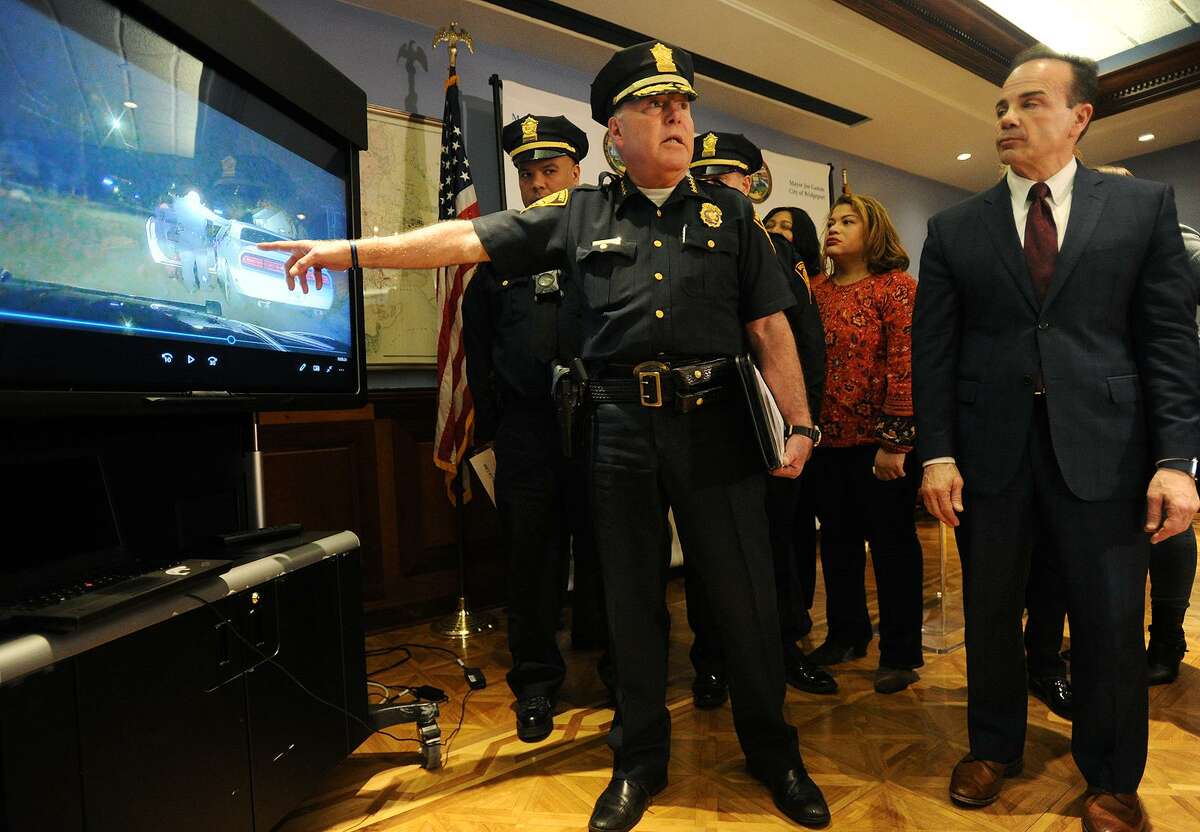Bridgeport Police Chief A.J. Perez shows a video of the city's new police body and dash cameras in use during the program's announcement at the Margaret Morton Government Center in Bridgeport, Conn. on Tuesday, February 20, 2018.