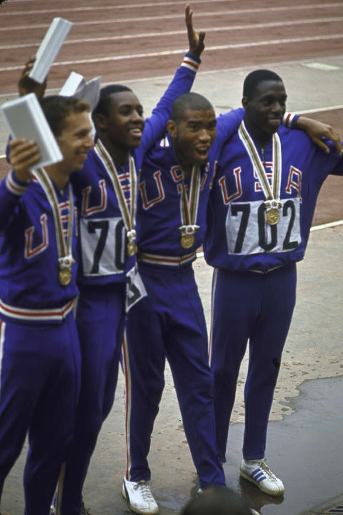 2) 1964: U.S. Track Team USA would totally put on these classic sweats today. It doesn't get anymore iconic than red, white, and blue (and gold.) The men's 4X100 meter relay team took first place that year in Tokyo.