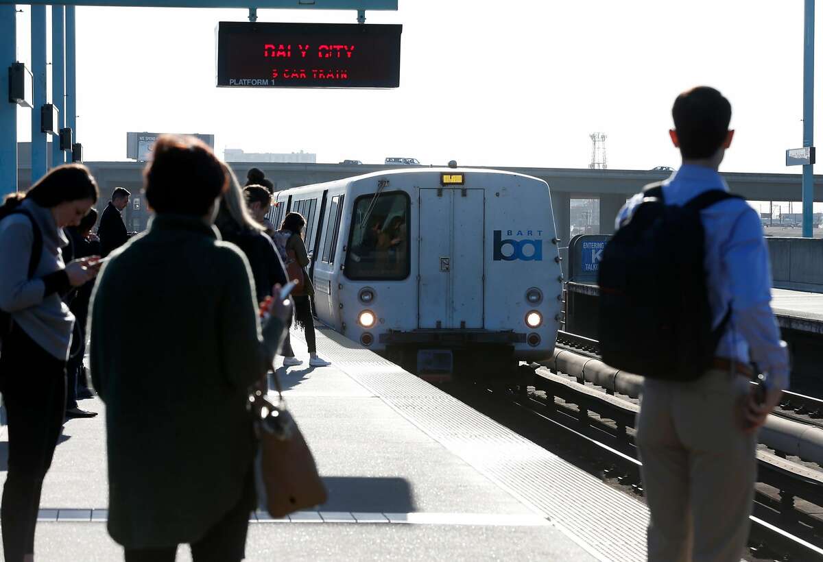 A westbound train arrives at the West Oakland BART station to pick up passengers in Oakland, Calif. on Friday, Feb. 16, 2018. BART officials will begin a study on the feasibility of a second transbay tube.
