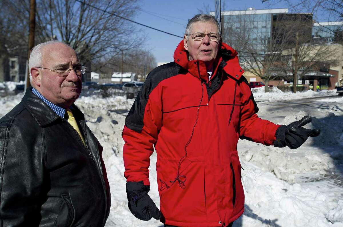 FILE — Stamford Mayor David Martin, right, and Director of Operations Ernie Orgera, left, talk about snow removal as city employees remove and relocate snow from Prospect Street and other downtown roads in advance of an oncoming snowstorm on Tuesday, February 11, 2014.