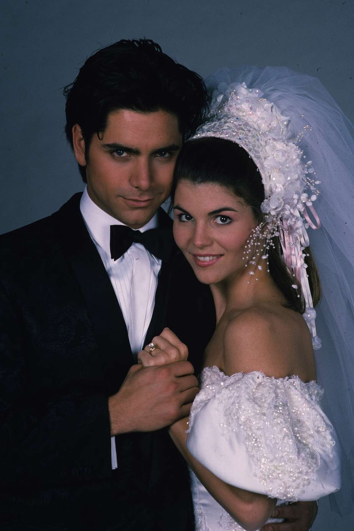 1) 'Full House': Rebecca "Becky" Donaldson Becky and Jesse were a couple just meant to be on Full House – Jesse was the motorcycle jacket-wearing ladies' man while Becky was the put-together news show host. The pair tied the knot in season 4, when Becky wore this off-the-shoulder puff-sleeve gown.
