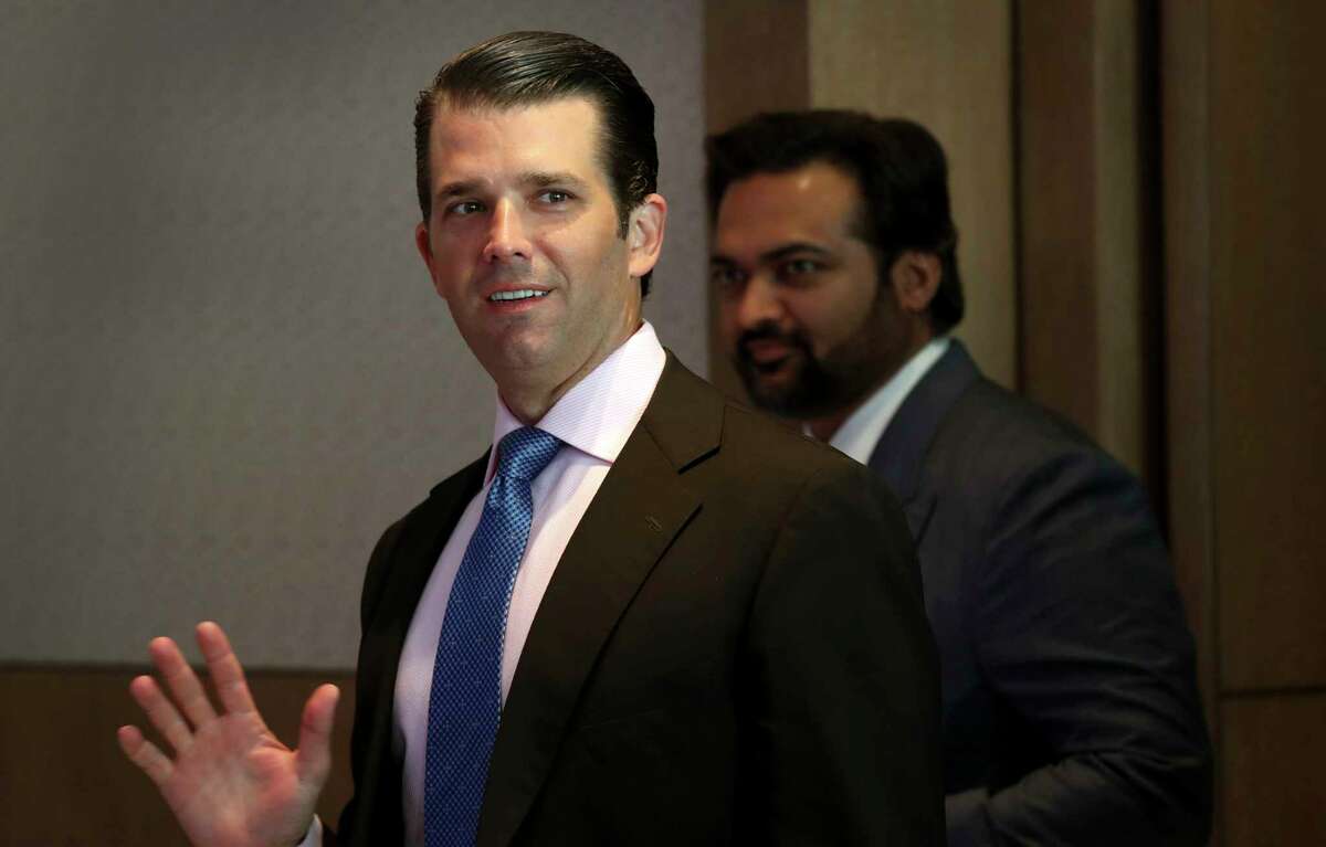 Donald Trump Jr. waves to media as he arrives for a meeting in New Delhi, India, Tuesday, Feb. 20, 2018. The eldest son of U.S. President Donald Trump has arrived in India to help sell luxury apartments and lavish attention on wealthy Indians who have already bought units in a string of Trump-branded developments. (AP Photo/Manish Swarup)