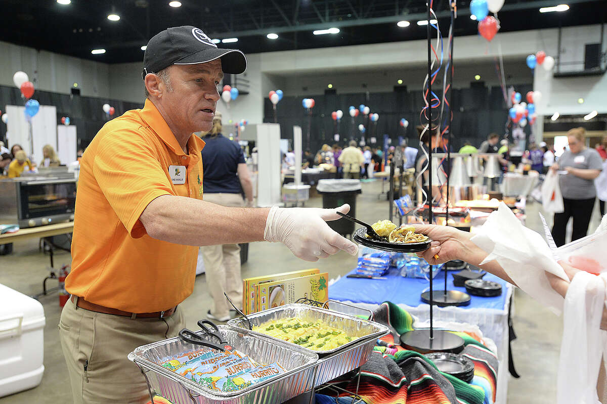 Samples are offered at the 18th annual Region 5 Food Service Cooperative's food show and tasting at the Civic Center Tuesday. Food service workers, teachers, administrators and students from the region's 50 districts, charter schools, churches and childcare centers got a chance to sample some of the latest menu items geared toward school cafeterias. With a shared goal of taste and nutrition in mind, vendors offered up a variety of food and beverages. Samplers then could vote on which of the items they liked best. The event offers districts the chance to improve upon their menus. Photo taken Tuesday, February 20, 2018 Kim Brent/The Enterprise