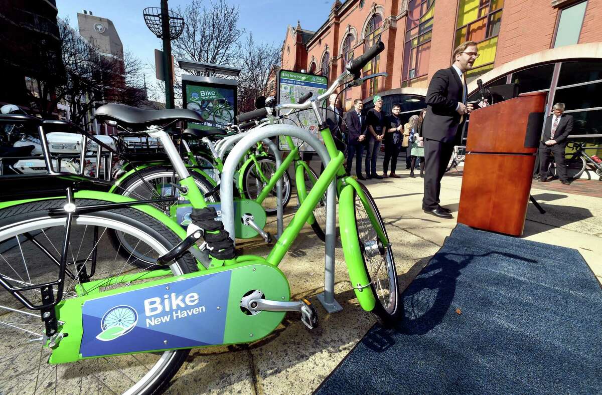 New Haven Director of Transportation, Traffic and Parking Doug Hausladen, right, speaks during the launch of the bike share program at the corner of Audubon and Orange streets in New Haven Tuesday.