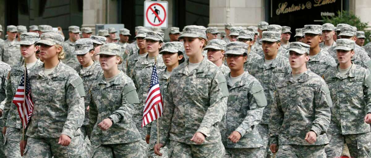 Members of the U.S. Army march Nov. 9, 2013 during the 13th annual Veterans Parade in downtown San Antonio, Texas. (For the Express-News)
