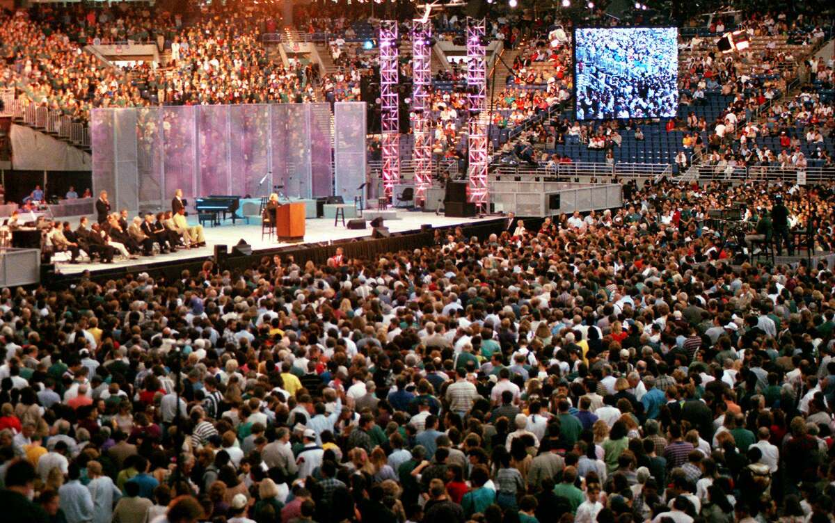 Billy Graham is surrounded by tens of thousands of people as he speaks on Sunday during his crusade at the Alamodome. 4-6-97. Jerry Lara/staff.