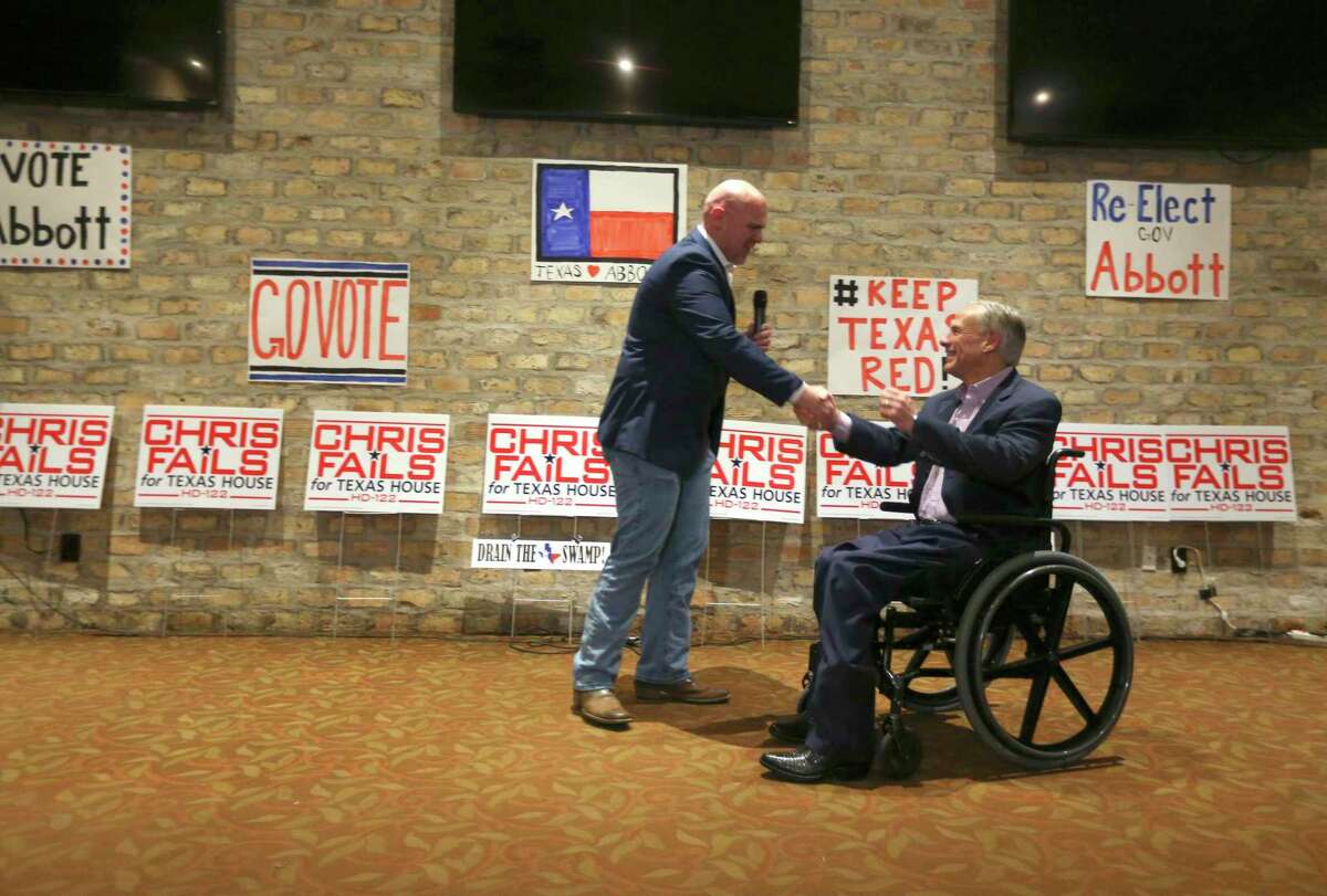 Then-Hollywood Park Mayor Chris Fails, then a primary challenger seeking to unseat state Rep. Lyle Larson, shakes hands with Gov. Greg Abbott in 2018.