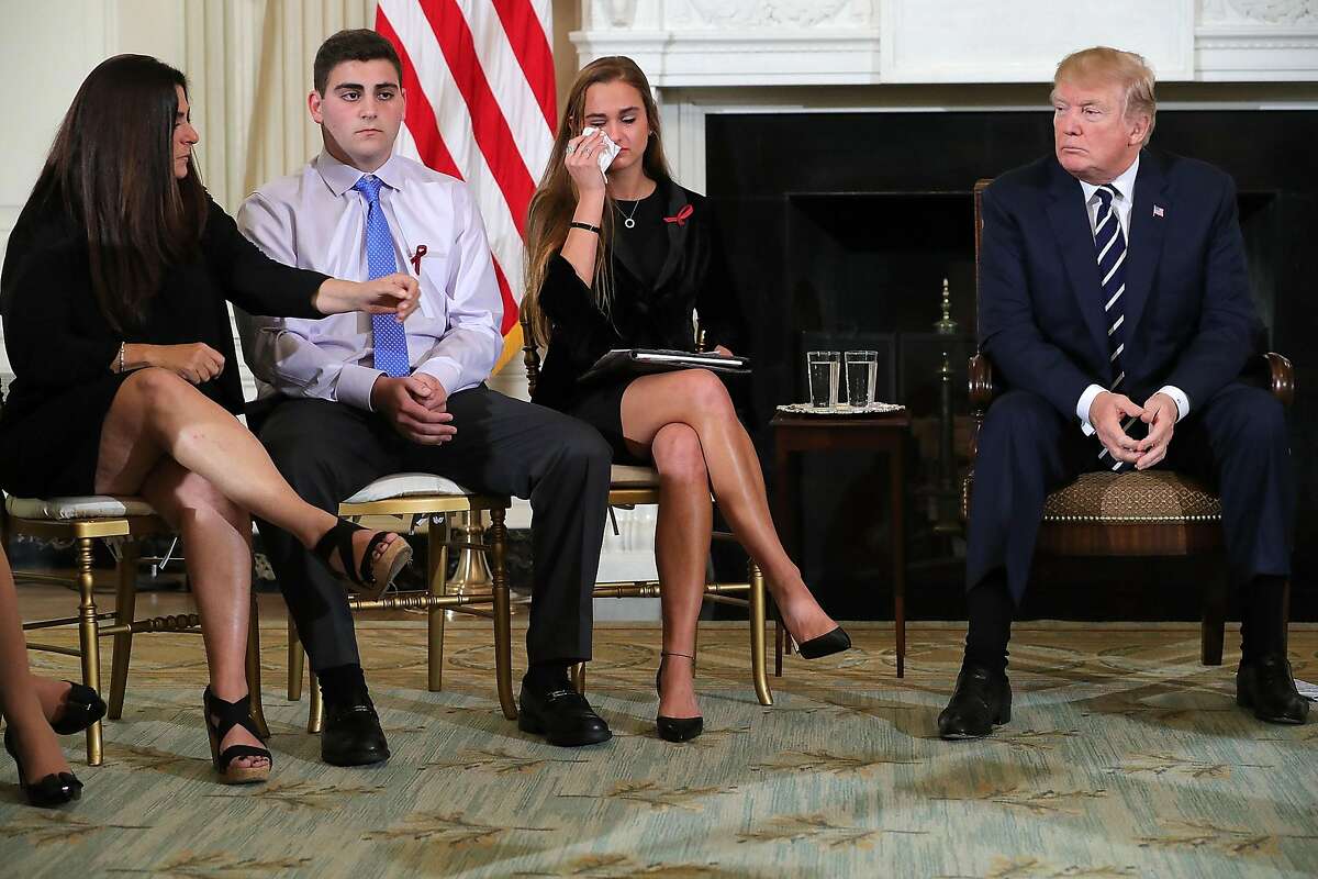 WASHINGTON, DC - FEBRUARY 21: (AFP OUT) U.S. President Donald Trump (R) hosts a listening session with Marjory Stoneman Douglas High School shooting survivors Julie Cordover (2nd R) and Jonathan Blank and his mother Melissa Blank and others in the State Dining Room at the White House February 21, 2018 in Washington, DC. Trump is hosted the session in the wake of last week's mass shooting at the high school in Parkland, Florida, that left 17 students and teachers dead. (Photo by Chip Somodevilla/Getty Images)