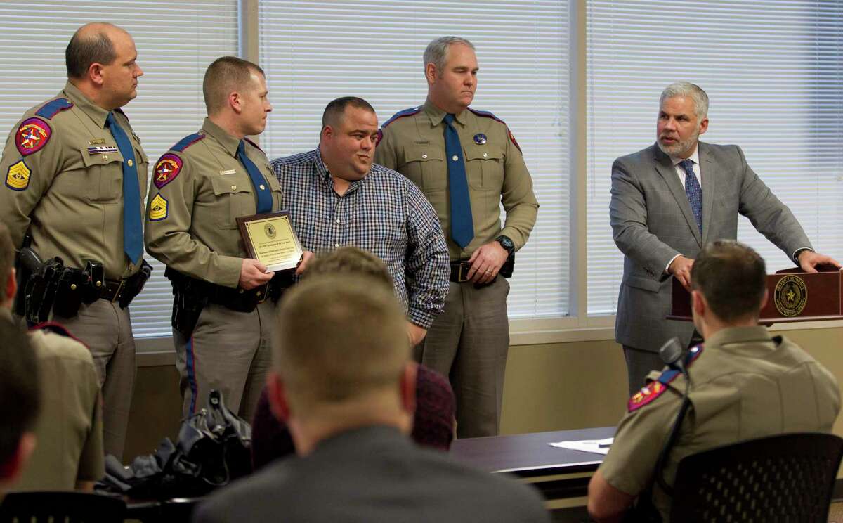 Montgomery County District Attorney Brett Ligon addresses troopers with the Department of Public Safety's District Crash Team listen after the team was named the DWI Investigator of the Year during the Montgomery County District Attorney's annual DWI awards at the Lee G. Alworth Building, Wednesday, Feb. 21, 2018, in Conroe.
