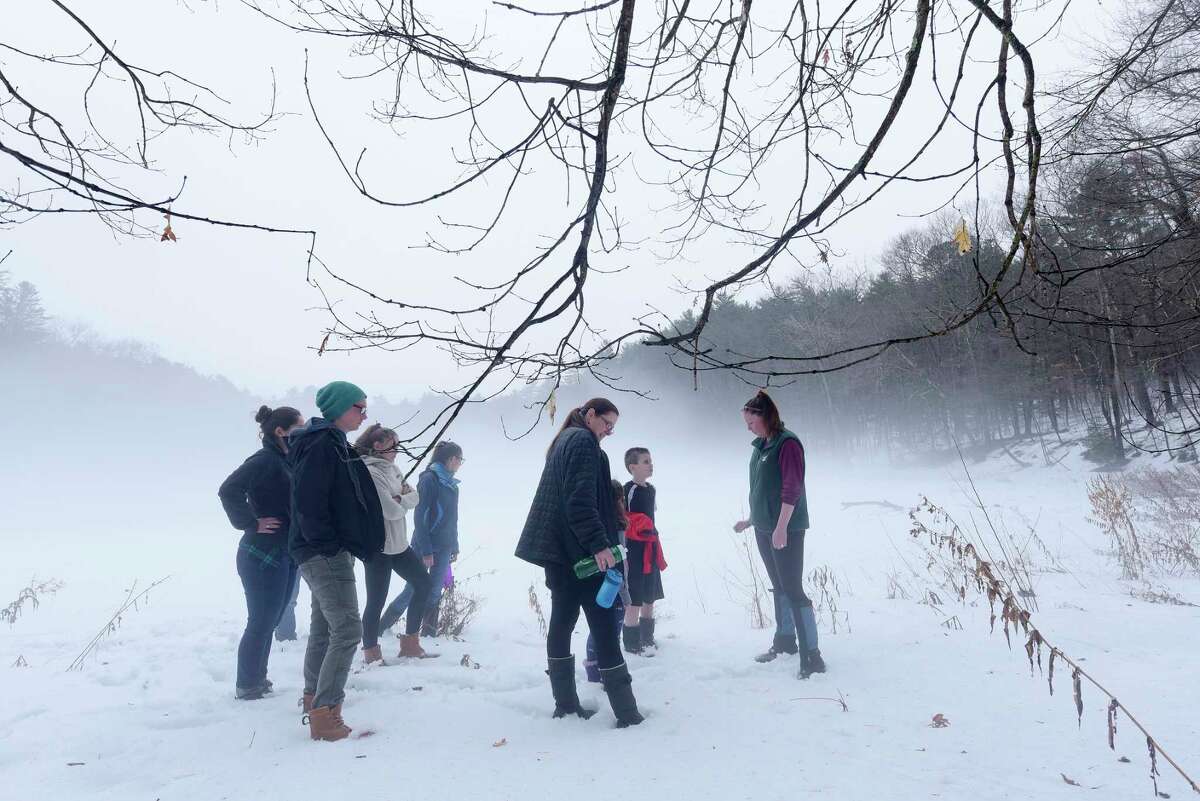 Rebecca Mullins, far right, the park educator at Moreau Lake State Park leads a group on a family nature hike around the lake on Wednesday, Feb. 21, 2018 (Times Union archive)
