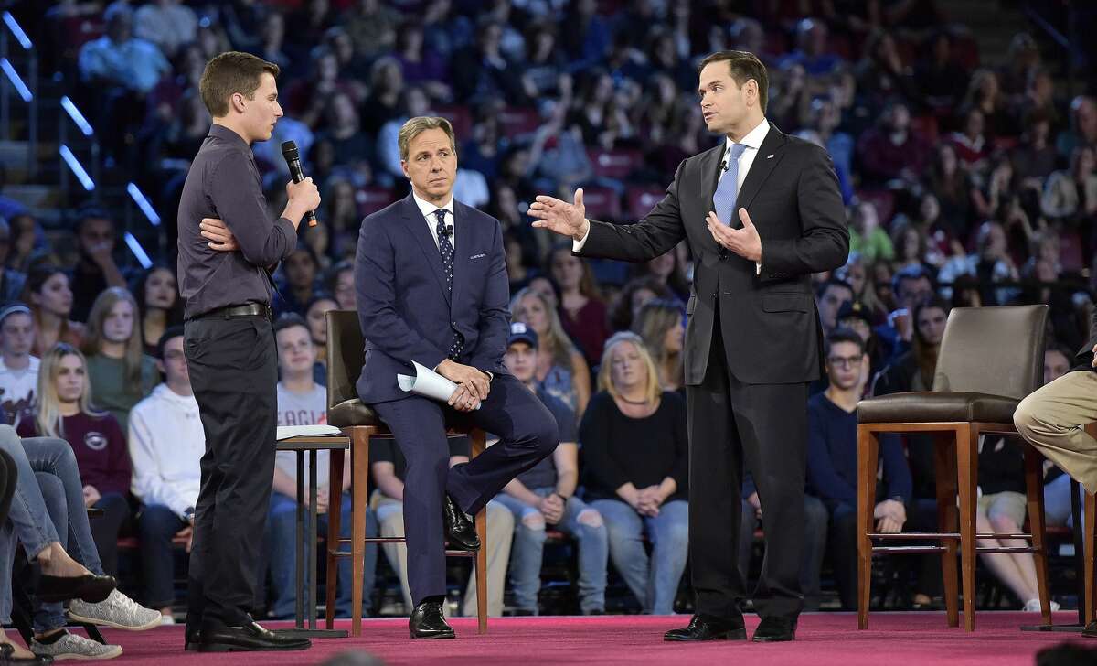Marjory Stoneman Douglas High School student Cameron Kasky asks a question to Sen. Marco Rubio during a CNN town hall meeting at the BB&T Center in Sunrise, Fla., Wednesday, Feb. 21, 2018. Rubio was put on the defensive Wednesday by angry students, teachers and parents who are demanding stronger gun-control measures after the shooting rampage that claimed 17 lives at a Florida high school. (Michael Laughlin/South Florida Sun-Sentinel via AP)
