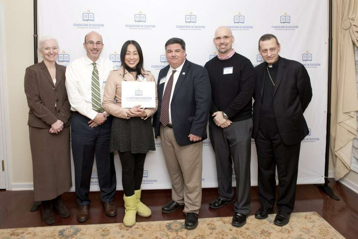 : Holly Doherty-Lemoine (Executive Director of Foundations in Education), Chris Cipriano (Notre Dame Principal), Sally Hong (Teacher), Steven Cheeseman (Superintendent), Bishop Frank Caggiano