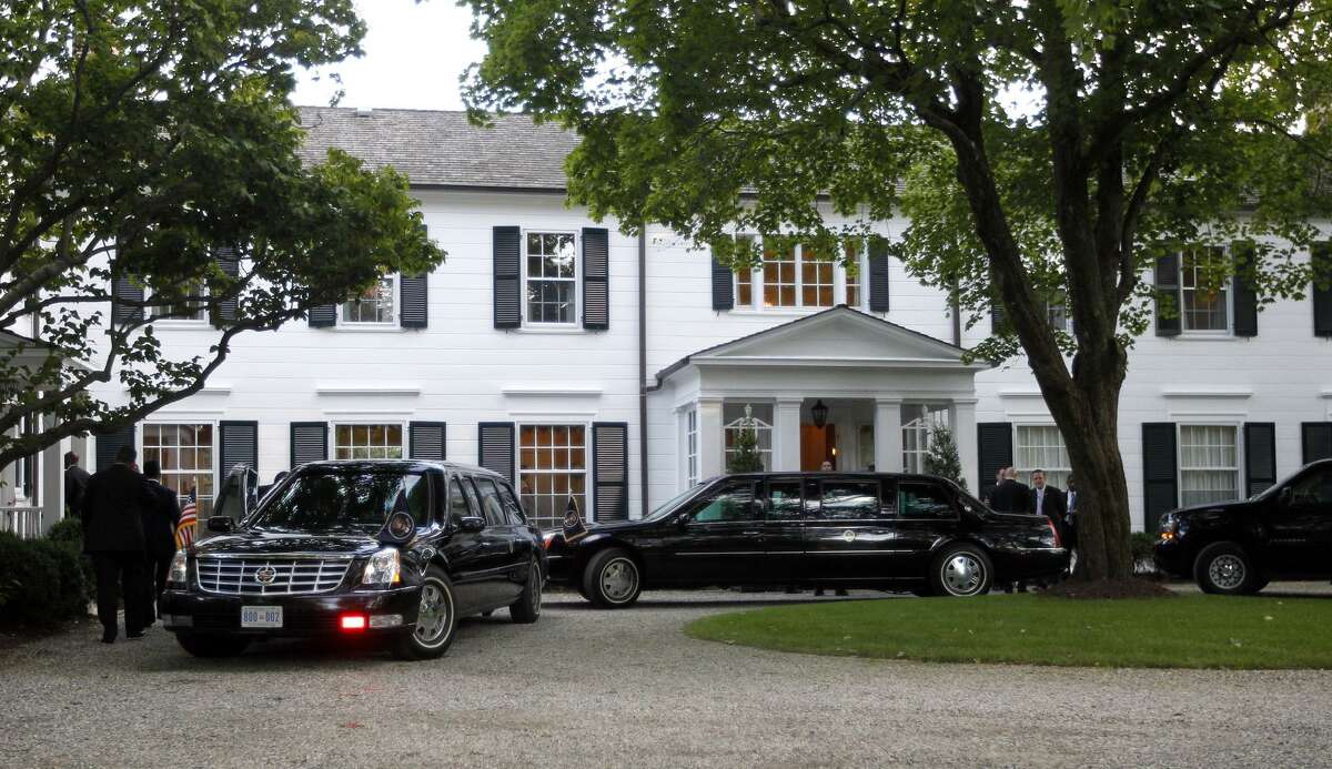 Limousines and motorcade vehicles for President Barack Obama are seen parked in the driveway outside the residence of movie producer Harvey Weinstein in 2012.