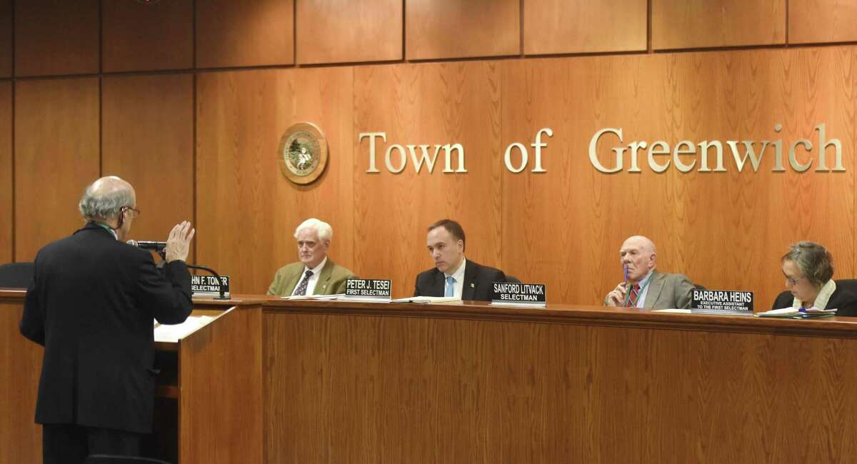 Town Attorney John Wayne Fox addresses Selectman John Toner, left, First Selectman Peter Tesei, center, and Selectman Sandy Litvack during the Board of Selectmen Meeting at Town Hall in Greenwich, Conn. Thursday, Feb. 22, 2018. Selectmen and representatives from Greenwich High School discussed a potential change in parking code that could remove street parking outside Greenwich High School.