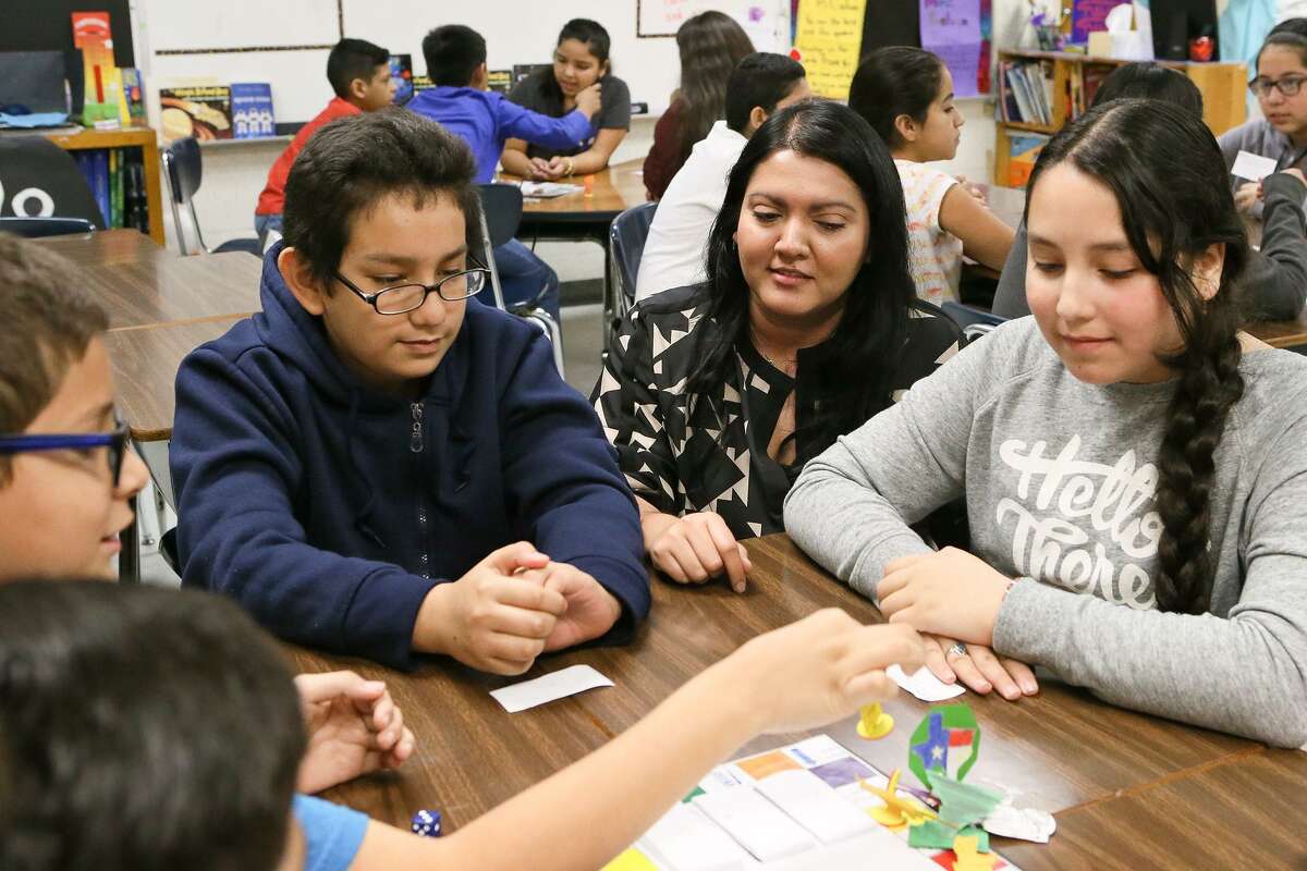A new partnership in San Antonio can boost after-school learning and help the area reach educational goals. Here, Gloria Galvan, a bilingual fifth grade teacher at Price Elementary School, engages in a science vocabulary word game with students.