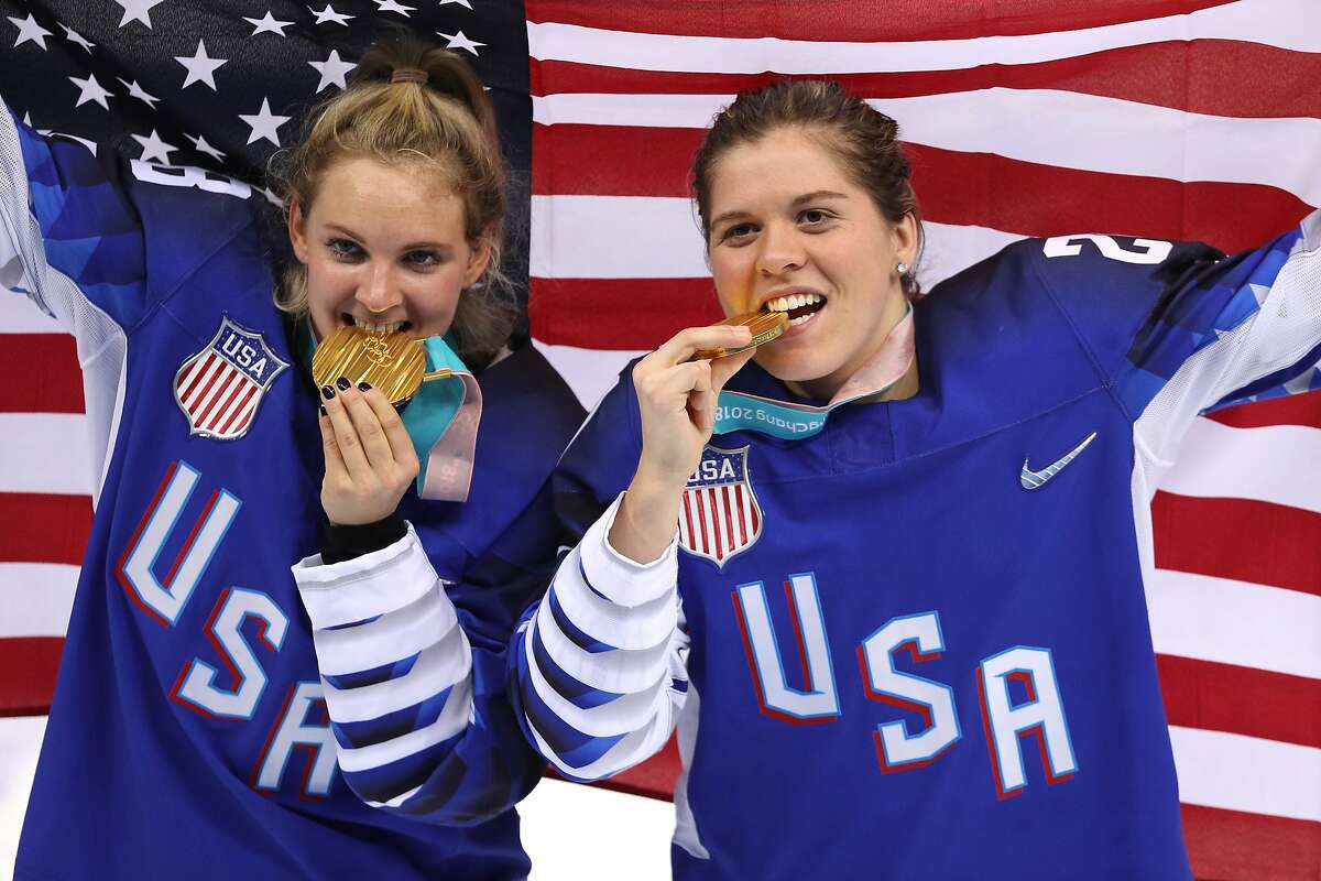 Gold medal winners Amanda Kessel #28 and Hannah Brandt #20 of the United States celebrate after defeating Canada in a shootout during the Women's Gold Medal Game on day thirteen of the PyeongChang 2018 Winter Olympic Games at Gangneung Hockey Centre.