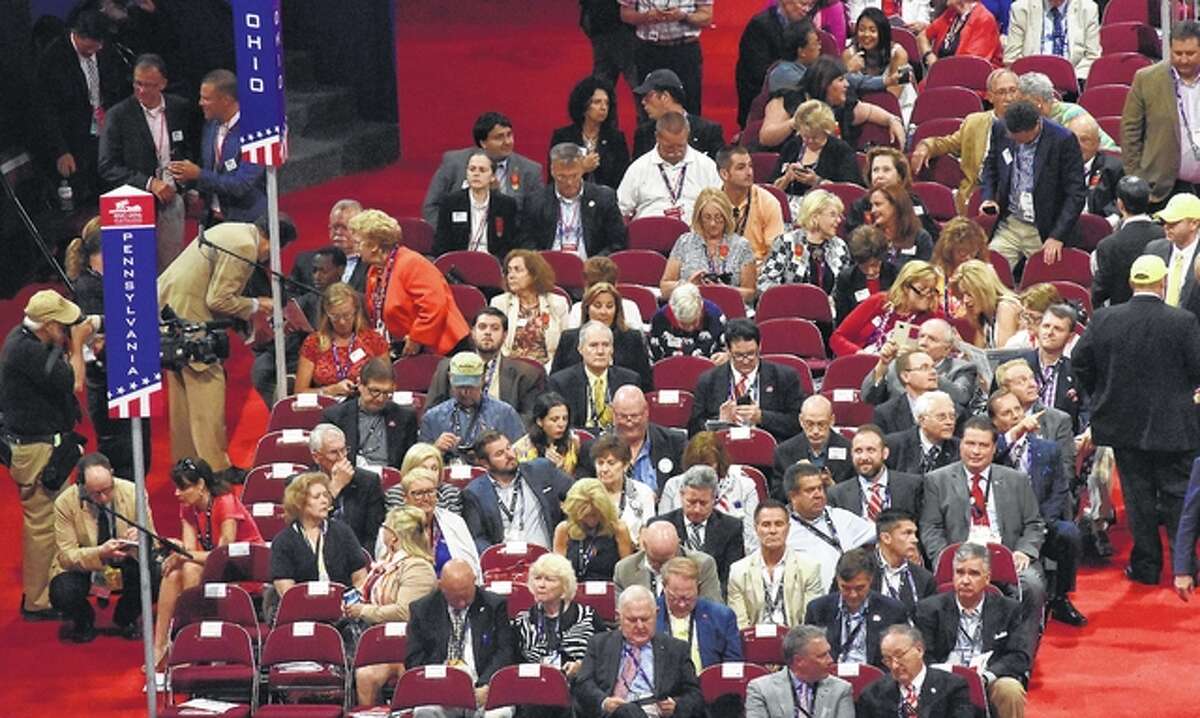 Pennsylvania and Ohio delegates gather on the floor of Quicken Loans Arena for the start of the Republican National Convention on Monday in Cleveland.