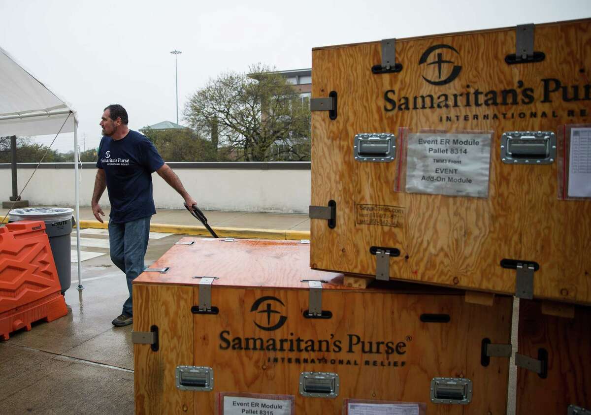 Mark Randolph of Samaritan's Purse helps to assemble an emergency field hospital before a media tour at Lakewood Church. The agency deployed a similar emergency field hospital in Iraq in early 2017. ﻿