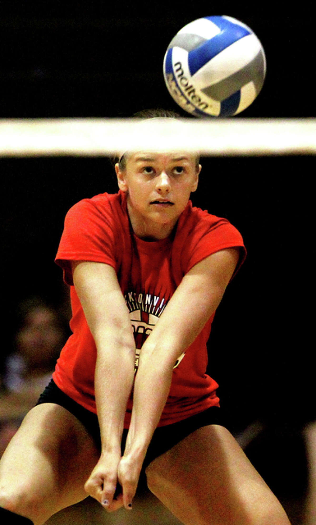Jacksonville’s Cassie Huey passes the ball during a recent match in the MacMurray College summer volleyball league.