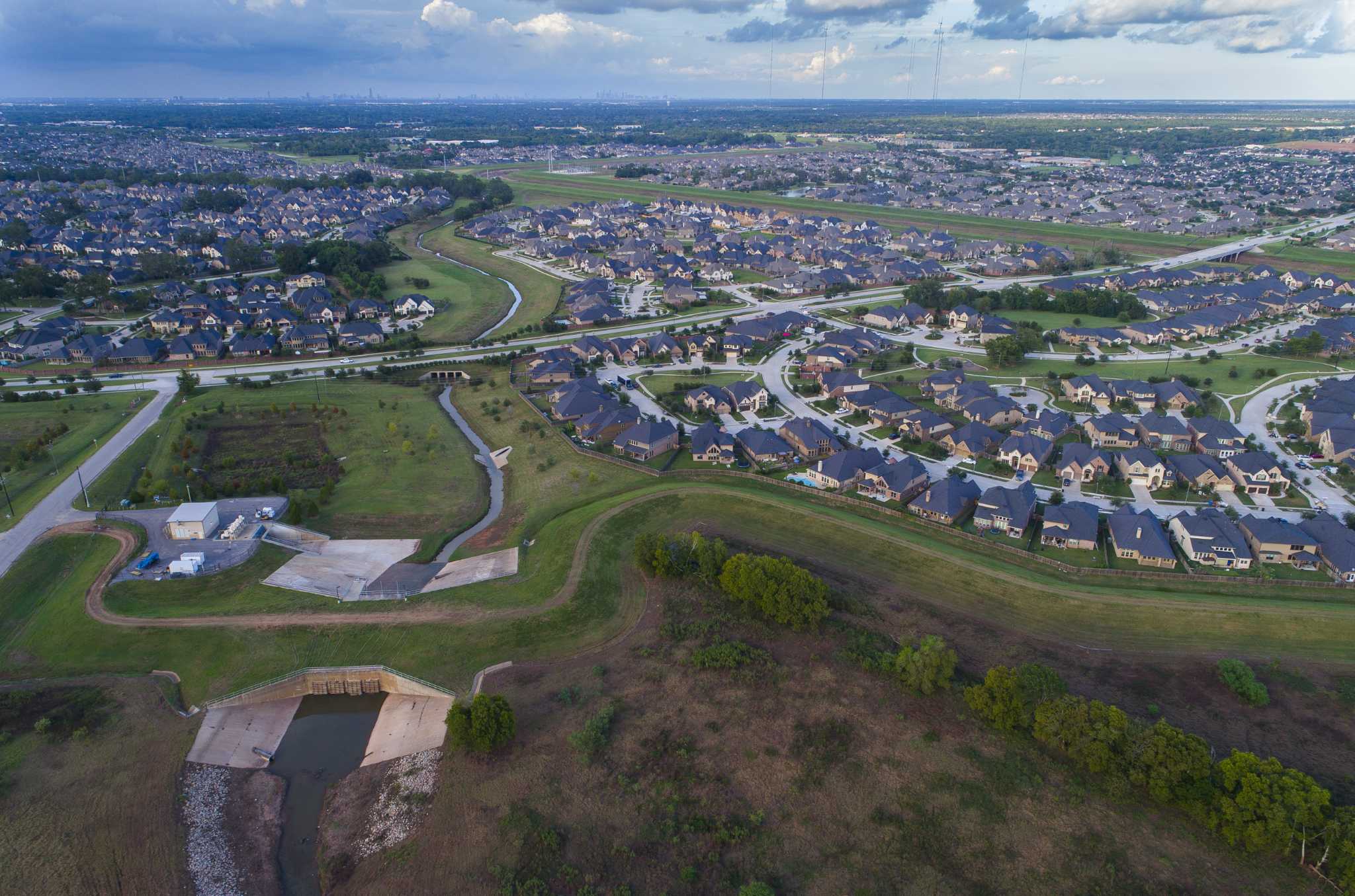 For two newcomers, a crash course in levees and girding for the next Harvey