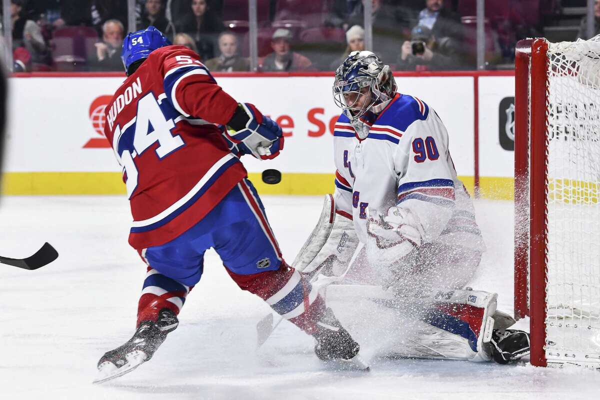 MONTREAL, QC - FEBRUARY 22: Goaltender Alexandar Georgiev #90 of the New York Rangers defends his net in his first ever NHL game against Charles Hudon #54 of the Montreal Canadiens during the NHL game at the Bell Centre on February 22, 2018 in Montreal, Quebec, Canada. (Photo by Minas Panagiotakis/Getty Images)