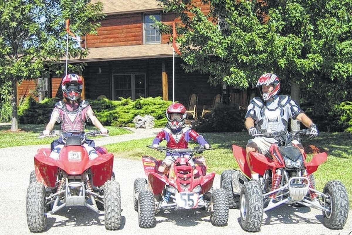Photo provided A family gears up to ride all-terrain vehicles at Harpole’s Heartland Lodge.