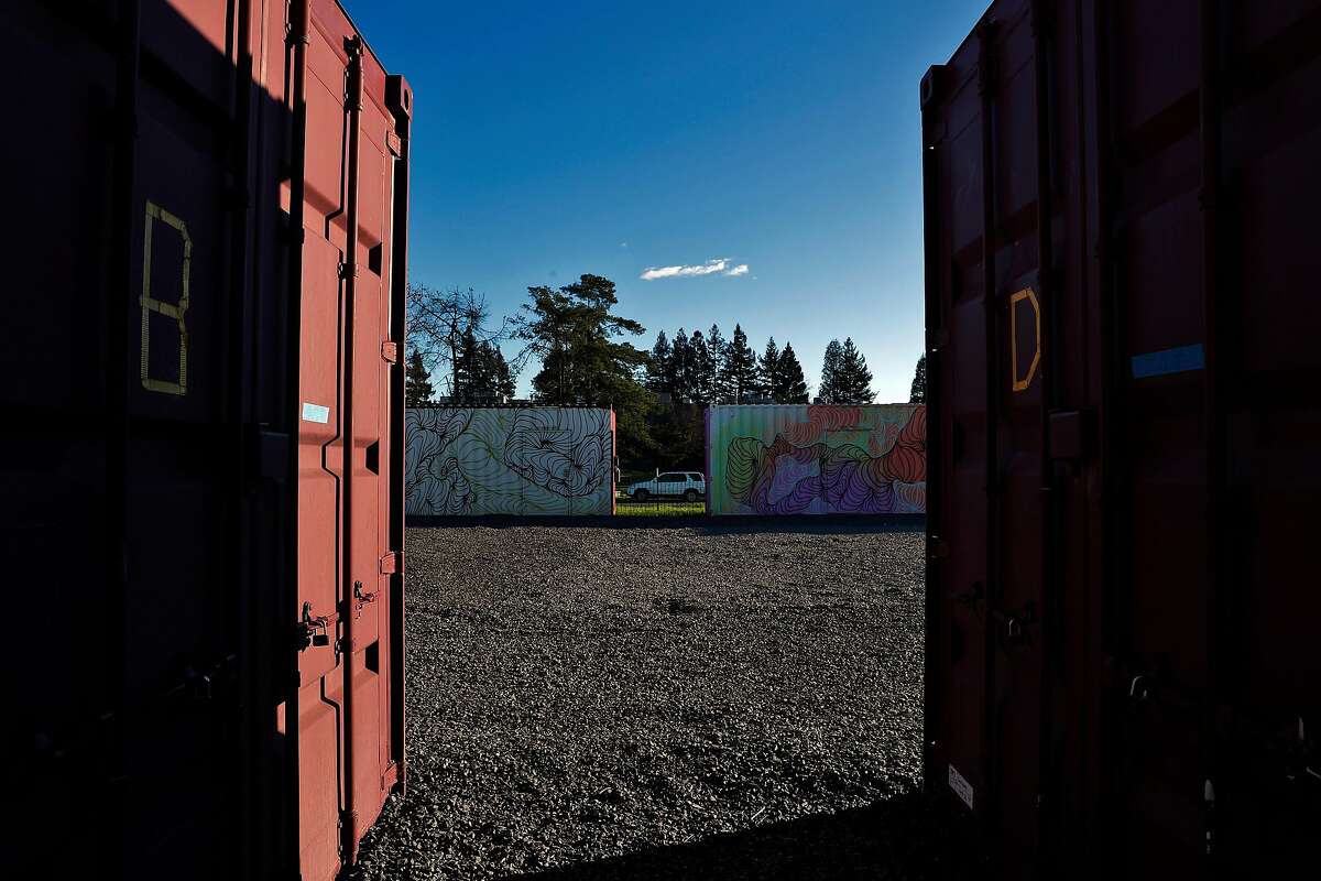Painted shipping containers at Oasis Village, a proposed and since-abandoned emergency housing center for North Bay fire victims in Santa Rosa, Calif., on Monday, February 12, 2018. Oasis Village was a series of temporary housing structures built after the fires by volunteers from the Burning Man community. The group tried (in vain) to convince the city of Santa Rosa that the village was ready to house people who had been displaced by the fires. The structures are six modified shipping containers and one modified 53-foot trailer. Inside there used to be beds and refrigerators, but now those have been removed, and the containers are locked -- the volunteers ultimately dismantled the project after getting sick of dealing with the city's red tape.