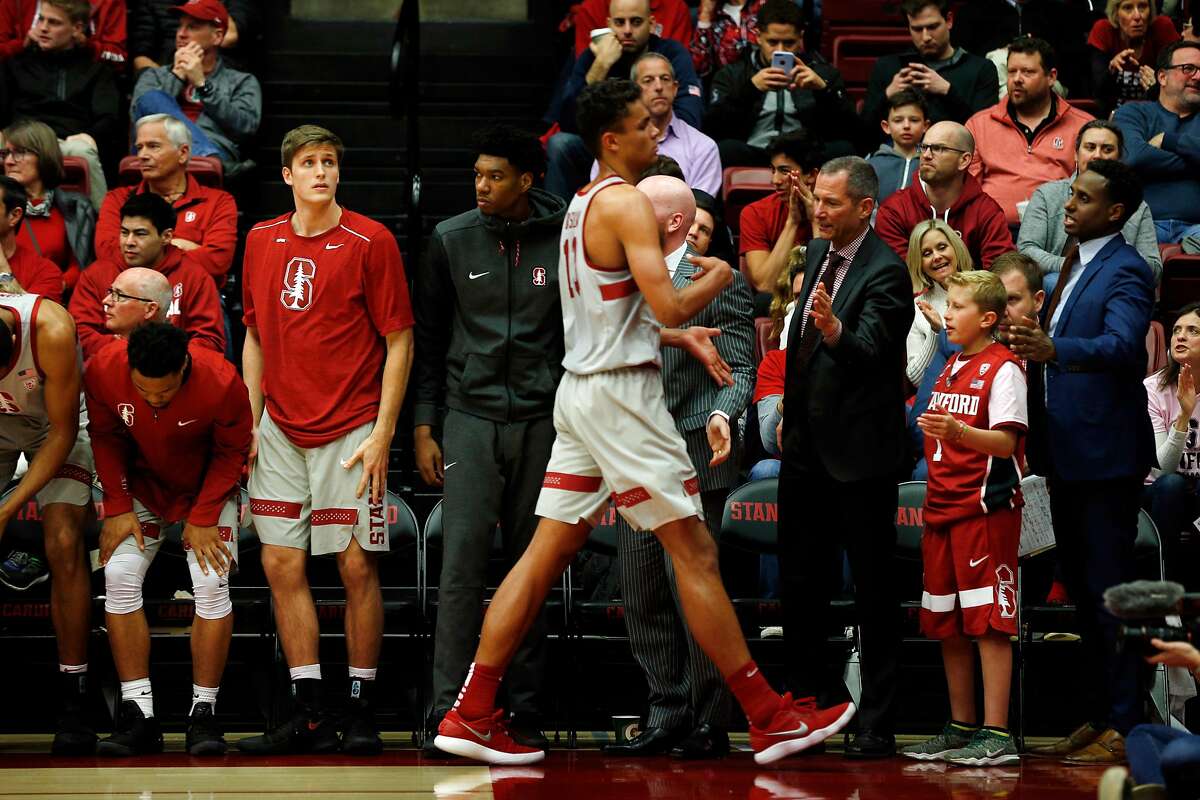 Second from right: Ty Whisler, 11, with the Stanford Cardinal bench greet Oscar Da Silva during the basketball game between the Stanford Cardinal and Washington Huskies at Maples Pavilion, Thursday, Feb. 22, 2018, in Stanford, Calif. The Cardinal won 94-78.