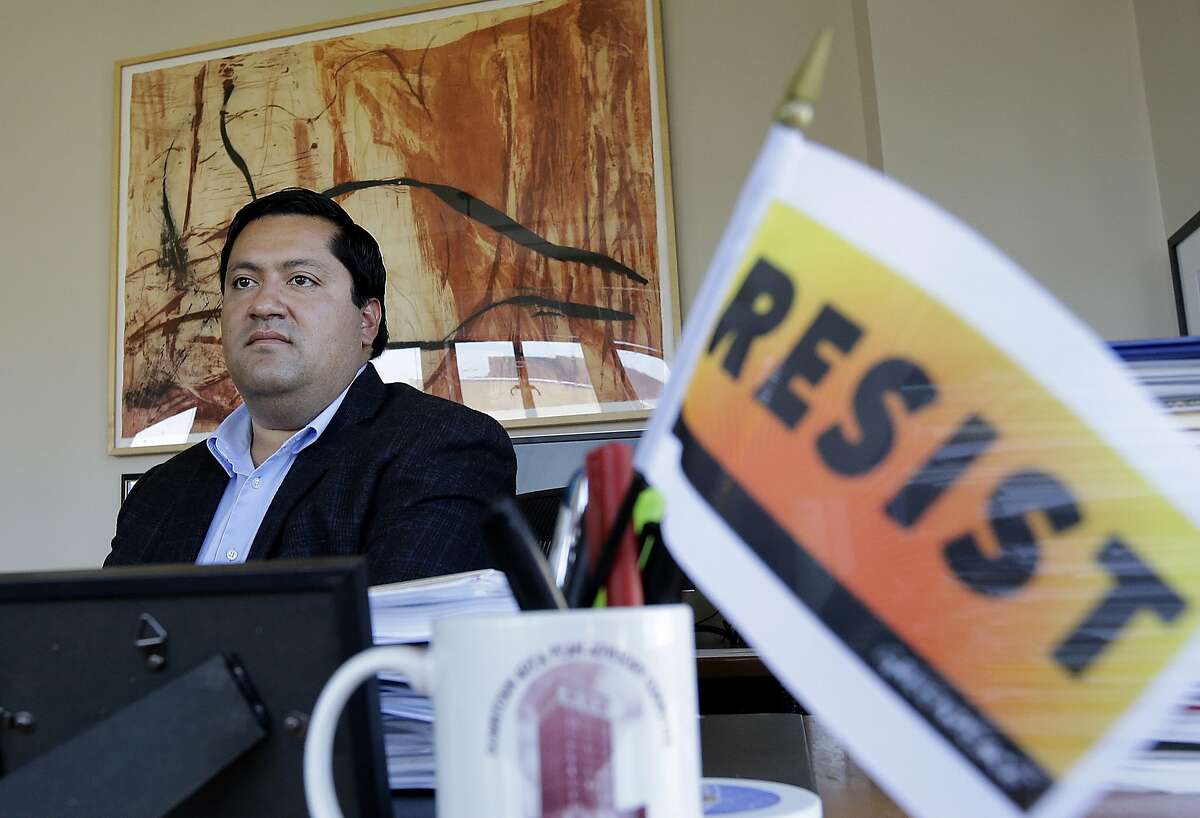 FILE - In this Aug. 28, 2017 file photo, Berkeley Mayor Jesse Arreguin poses for photos in his office while being interviewed in Berkeley, Calif. Berkeley on Tuesday, Feb. 13, 2018, declared itself a sanctuary city for marijuana users, prohibiting city employees from assisting federal officials in the enforcement of federal marijuana laws. (AP Photo/Jeff Chiu, File)