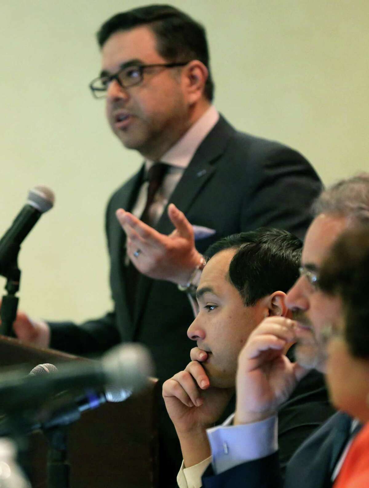 U.S. Rep. Joaquin Castro, center, sitting on a panel at the Conference Advancing the Science of Cancerin Latinos, listens to Dr. Esteban Lopez of Blue Cross Blue Shield of Texas, at the Marriott Plaza on Friday, Feb. 23, 2018.