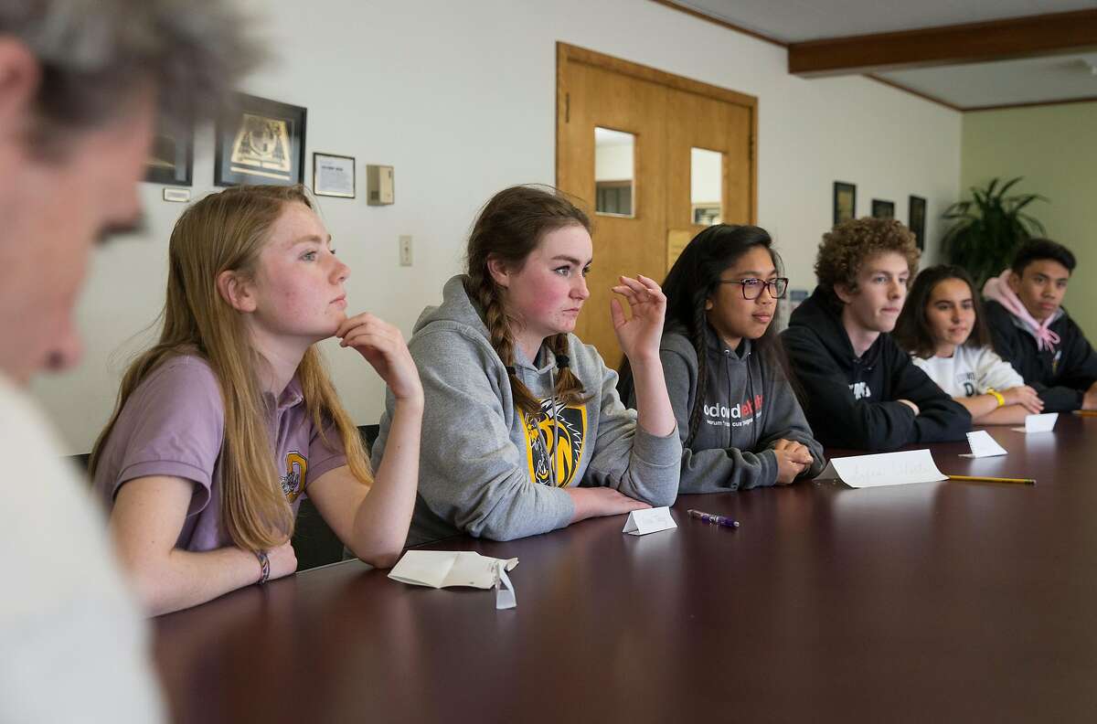 (From left) Bishop O'Dowd High School junior Alden O'Rafferty, 16, junior Olivia Talley, 16, junior Sofia Odeste, 17, junior Eli McAmis, 16, freshman Paulina Harding, 14, and freshman Aleki Lozano, 14, speak about their thoughts and feelings in the wake of the recent Parkland, Florida high school shooting Thursday, Feb. 22, 2018 in Oakland, Calif.