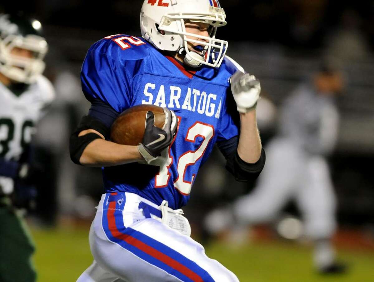 Saratoga's Ryan Seymour returns the initial kickoff back for a touchdown against Shenendehowa. (Cindy Schultz / Times Union)