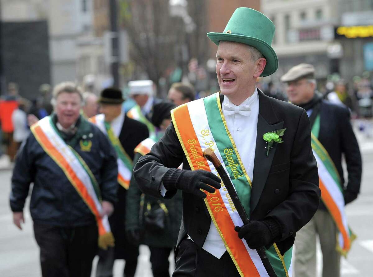 Connecticut Supreme Court Justice Andrew McDonald marches down Bedford Street during the annual St Patrick?’s Day parade in Stamford, Conn. on March 5, 2016. McDonald was the 2016 Grand Marshal for the event.