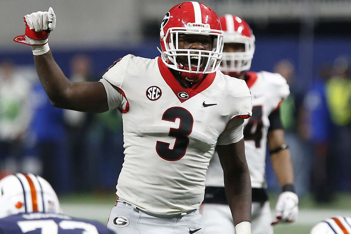 FILE - In this Dec. 2, 2017, file photo, Georgia linebacker Roquan Smith (3) yells out commands before Auburn runs a play during the second half during an NCAA college football game for the Southeastern Conference championship, in Atlanta. Smith was selected to the AP All-Conference SEC team announced Monday, Dec. 4, 2017. (Joshua L. Jones/Athens Banner-Herald via AP, File)