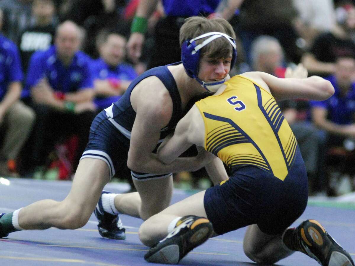 Wilton’s Travis Longo wrestles in the 106-pound final at the State Open, held in New Haven Saturday.