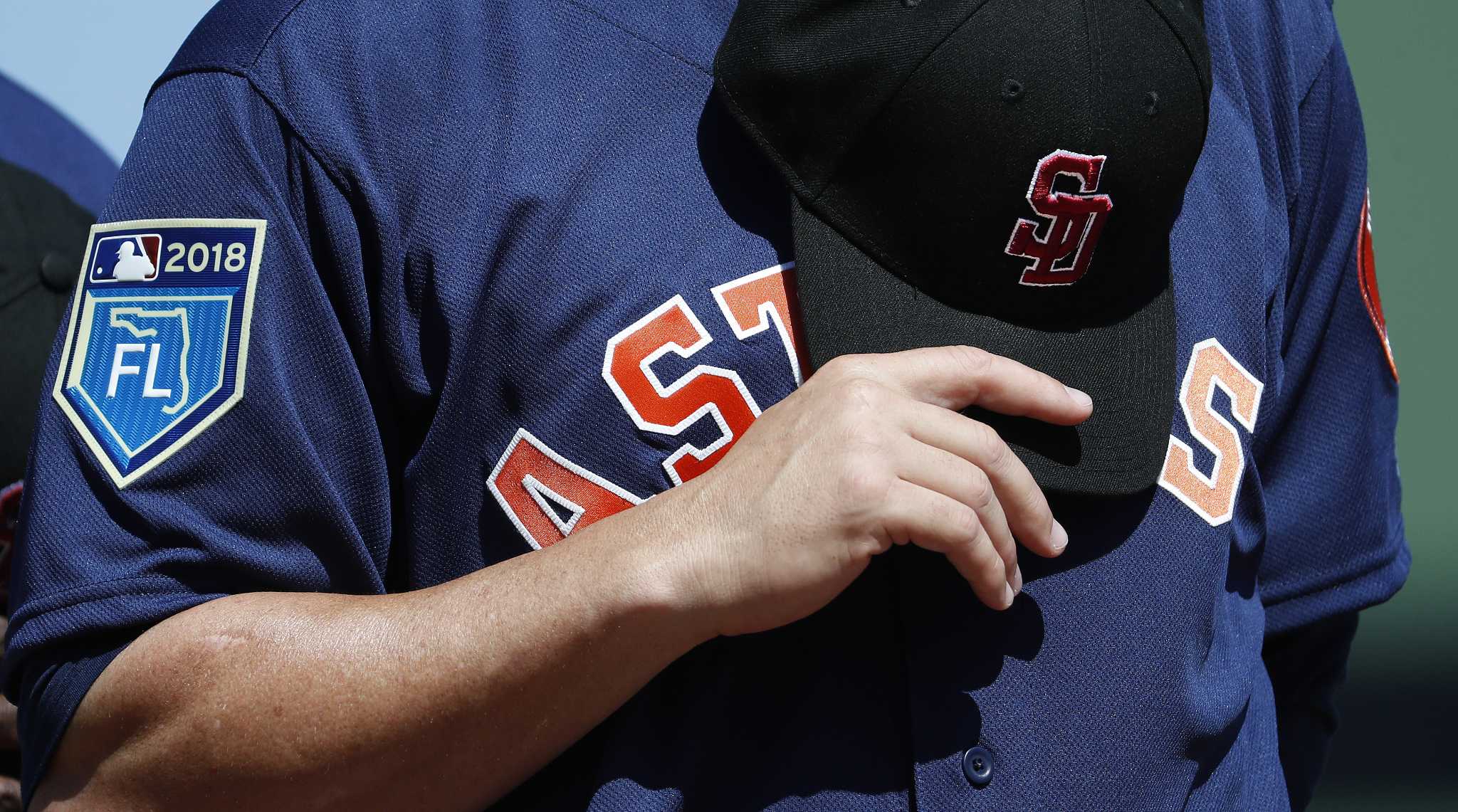 MLB teams wearing Marjory Stoneman Douglas High School caps at